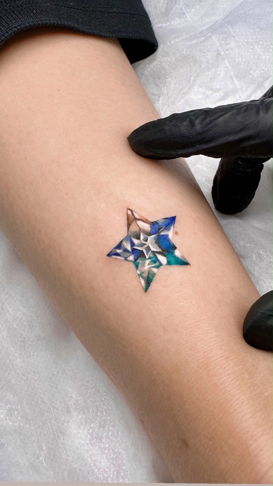 color geometric crystal star on forearm